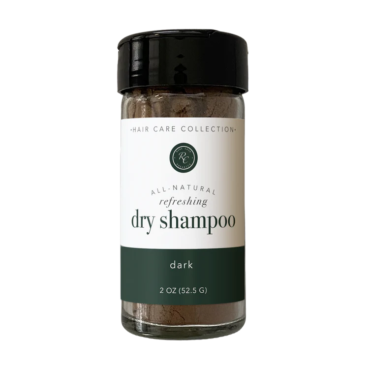 Rowe Casa All-natural dry shampoo bottle with a black cap on a white background for dark hair.