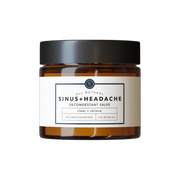 Jar of decongestant salve on a white background
