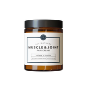 Jar of all-natural muscle and joint cream on a white background