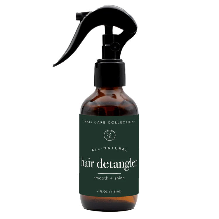 rowe casa Brown bottle of hair detangler with a black spray nozzle on a white background