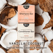 Shampoo and conditioner bars with coconut pieces on a white background