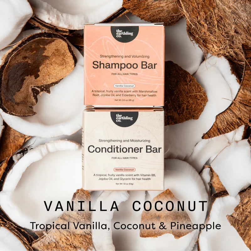 Shampoo and conditioner bars with coconut pieces on a white background
