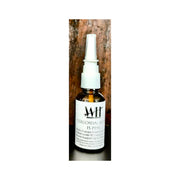 Bottle of colloidal silver with a wooden background